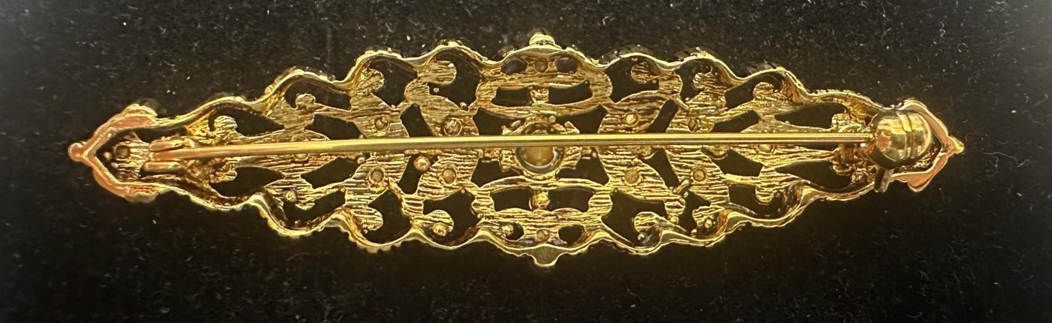 Broche mantilla rodio
