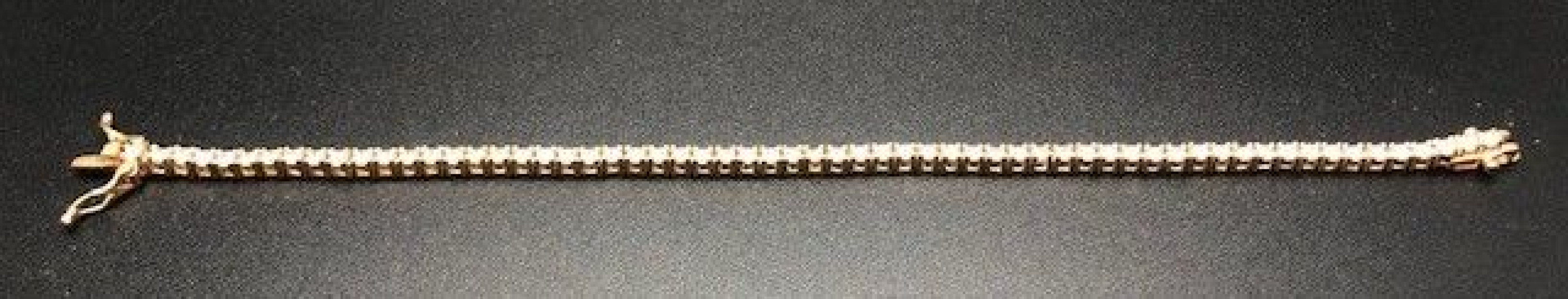 Pulsera fina dorada con circonitas redondas