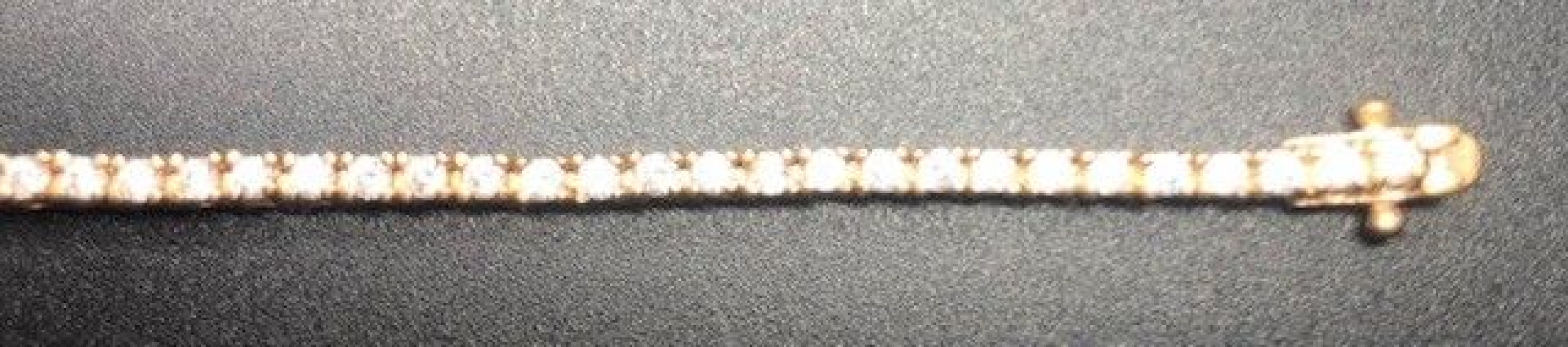 Pulsera fina dorada con circonitas redondas