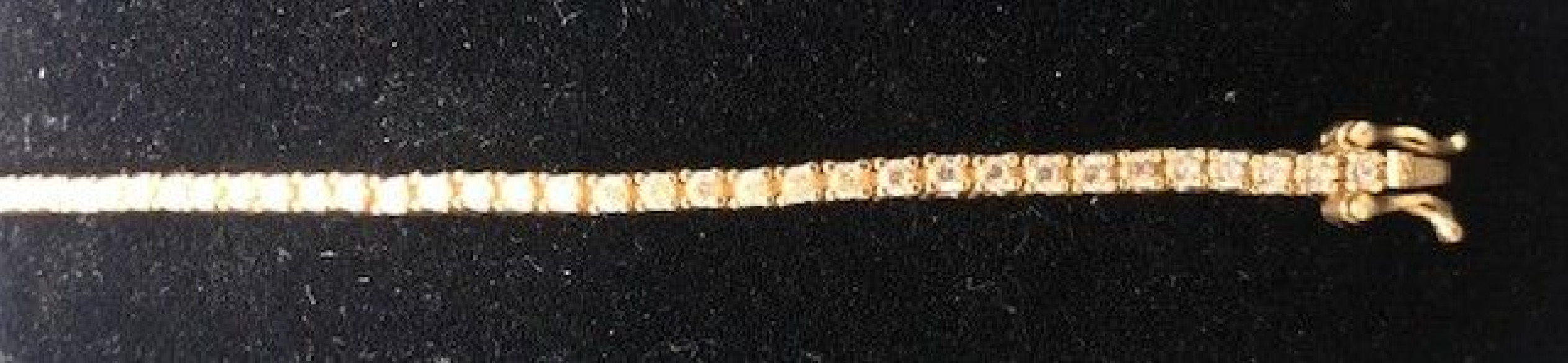 Pulsera fina dorada con circonitas redondas